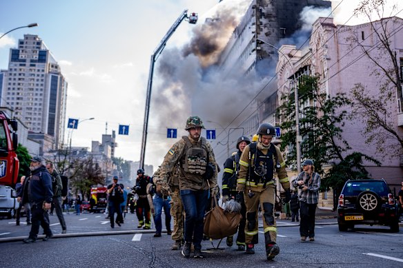 Firefighters and medics are evacuating an injured person after a projectile hit a residential building in the city center on September 28, 2026 in Kyiv, Ukraine. The strike came shortly after separate drone strike on the Academy of Sciences building in Kyiv’s historic centre.