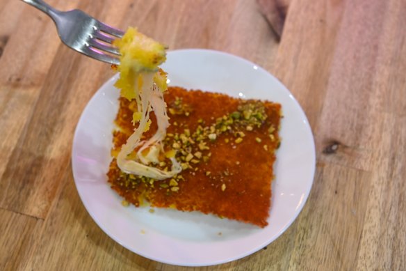 The cheesy namesake knafeh pastry.