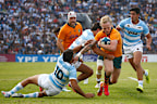 Carter Gordon of the Wallabies is challenged by Ignacio Mendy and Santiago Carreras.