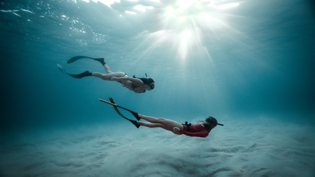 Free-diving off North Bondi. “The ocean is a great healer,” says instructor Bella Massey, right. 