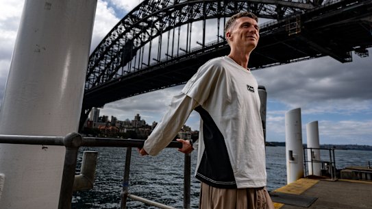 Andy Buchanan, the leading Australian male entrant in the Sydney Marathon, posing under the Harbour Bridge.