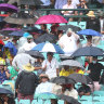 Rain and Omicron temper a buoyant crowd on day one of the Sydney Test