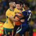Aziz Behich pushes Endrick.