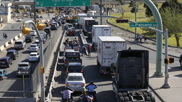 Cars and trucks line up to enter Mexico from the US at a border crossing in El Paso, Texas, on Friday, March 29.