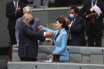 Prime Minister Scott Morrison embraces Liberal MP Nicolle Flint after she delivered her valedictory speech.