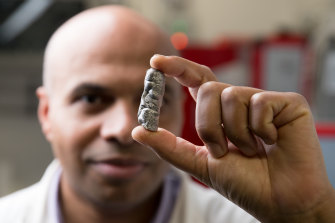 Professor Kondo-Francois Aguey-Zinsou holds some of the metal material that his team has developed that can store hydrogen in a solid state.