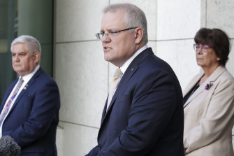 Minister for Indigenous Australians Ken Wyatt, Prime Minister Scott Morrison and Pat Turner, chief executive of the National Aboriginal Community Controlled Health Organisation on Thursday. 