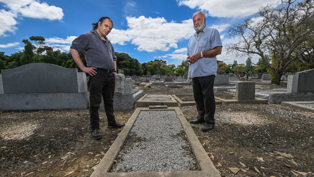  Carl Johnson (left)  and Lambis Englezos inspect the decommissioned grave of Private John Edward Collier, with only a small tin plate identifying him. Collier, who enlisted with the Australian Army Veterinary Corps but transferred to the 14th Battalion, was blown up and gassed at Ypres, Belgium, in 1917. He died in 1924 on Anzac Day. The cause of his death is unknown.