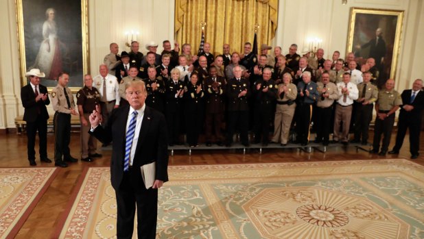 US President Donald Trump speaks to members of the media during a meeting with sheriffs from across the country at the White House.