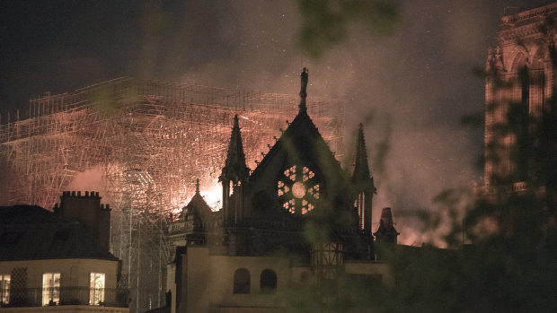Flames and smoke rise from a fire at Notre-Dame Cathedral.