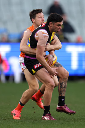 Got you: Giants captain Toby Greene tackles Tim Taranto at the MCG on Sunday.