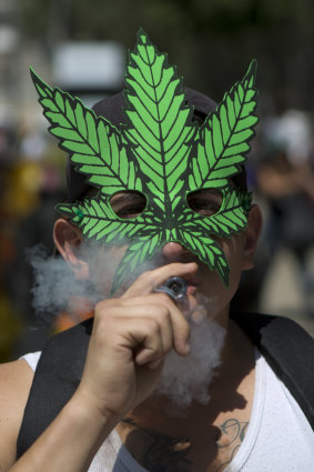 A young man smokes marijuana to celebrate the International Day for Cannabis in Mexico City. 
