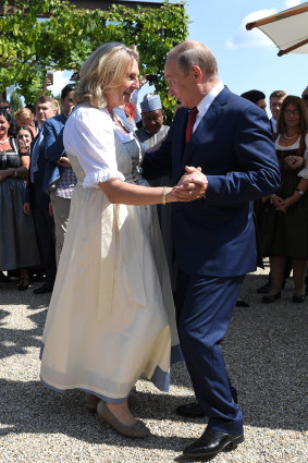 Russian President Vladimir Putin dances with Austrian Foreign Minister Karin Kneissl at her wedding in Gamlitz, southern Austria, in August of last year.