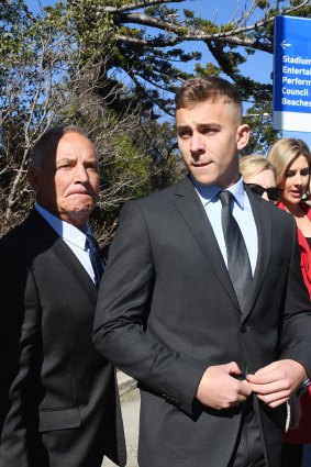 Callan Sinclair, right, leaves Wollongong Local Court last month.