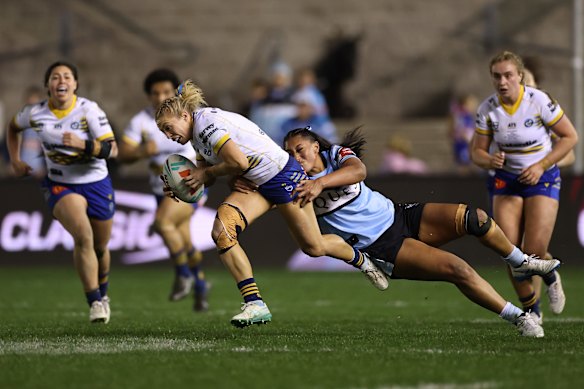 Abbi Church takes on the Sharks defence.