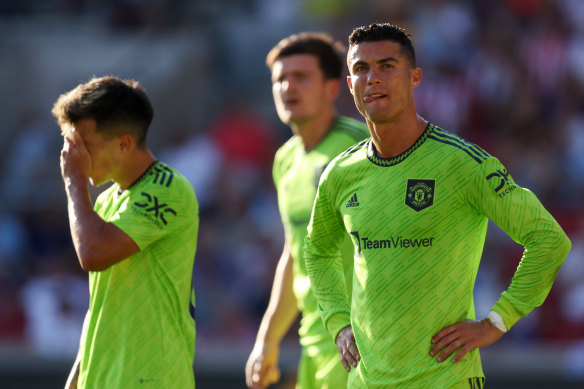 A shellshocked Lisandro Martinez and Cristiano Ronaldo react during Manchester United’s humiliation against Brentford.