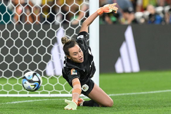 Mackenzie Arnold of Australia dives as Vicki Becho of France misses her team’s 10th penalty in the penalty shootout.