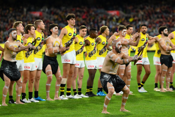 Richmond players and Indigenous performers before their game against Melbourne at the MCG last week.