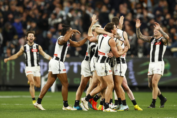 The Magpies celebrate after the final siren in their last-gasp win over Carlton.