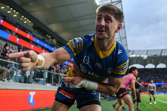 Zac Lomax celebrates a try for Parramatta.