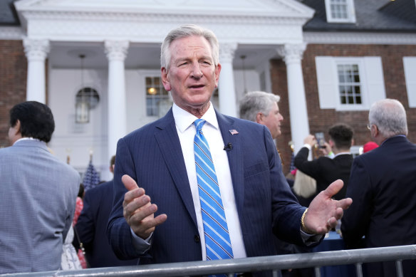 Republican Senator Tommy Tuberville, talks during a television interview before Donald Trump speaks at the Trump National Golf Club.