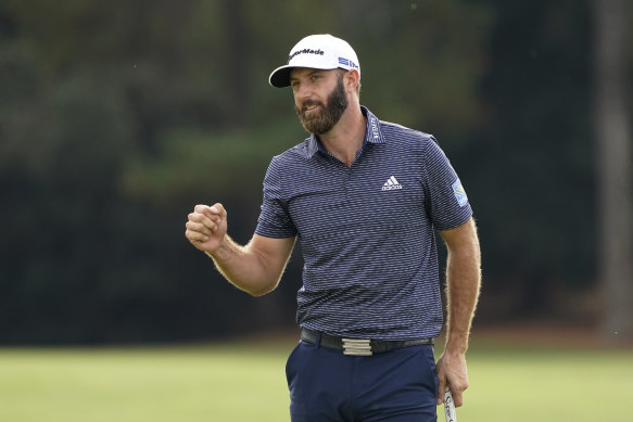 Dustin Johnson celebrates after winning his first Masters tournament in Augusta, Georgia.