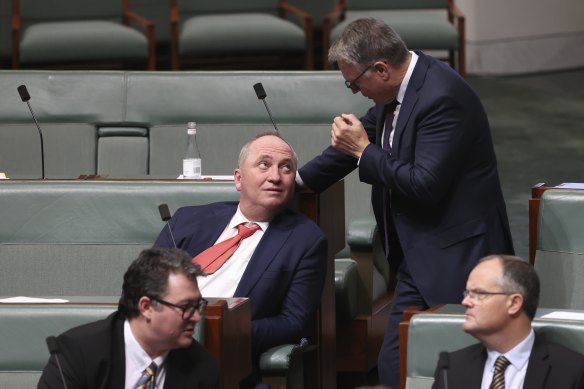 Barnaby Joyce chats to Labor MP Joel Fitzgibbon during question time at Parliament House this month.