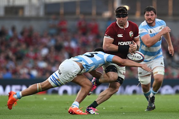 Tom Curry of British & Irish Lions is tackled 