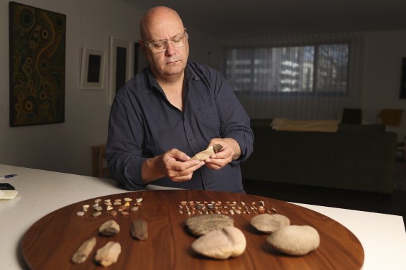 Institute of Aboriginal and Torres Strait Islander Studies chief executive Craig Ritchie with Indigenous stone tools.