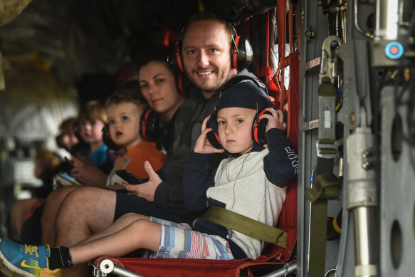 Tim Buckley and son Jackson on board a Chinook helicopter with their family Meaghan Wegg and Georgia.