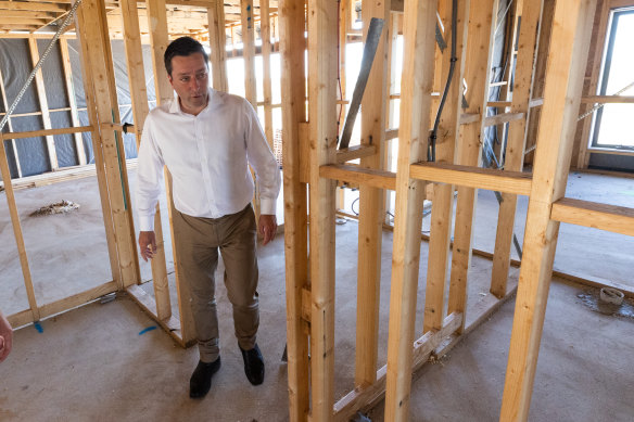 Matthew Guy tours a house under construction in Manor Lakes. He has promised $261 million to remove stamp duty for first-home buyers
