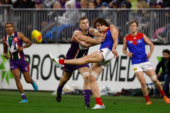 Luke Jackson gets a kick away under pressure from Sean Darcy who might be his teammate in 2023.