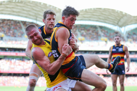 Nathan Broad has received a suspension for this sling tackle on Adelaide’s Patrick Parnell. 