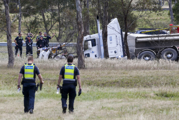 Police officers at the crash scene.