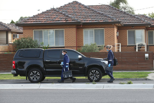 Forensic police work at the scene of the fatal shooting on Friday morning. 