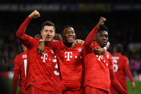 From left: Bayern Munich's Robert Lewandowski, David Alaba and Alphonso Davies celebrate a big win over Chelsea.