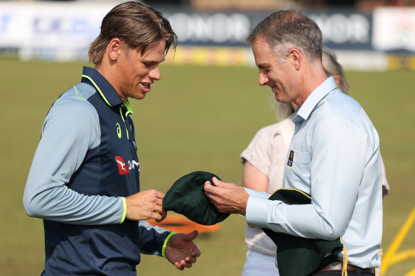Cooper Connolly is presented with his baggy green cap by Simon Katich.