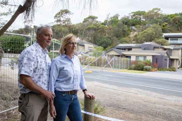 Gerry and Bronwyn Borghesi at the bottom of the hill where a landslide destroyed the home below theirs.