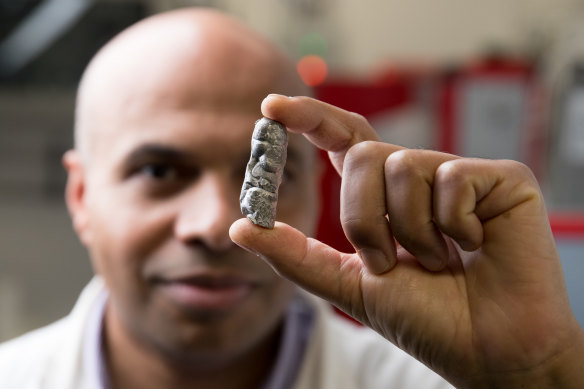 Professor Kondo-Francois Aguey-Zinsou holds some of the metal material that his team has developed that can store hydrogen in a solid state.