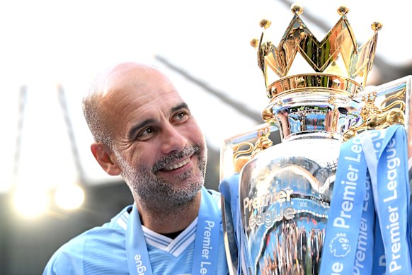 Pep Guardiola with the 2023-24 Premier League trophy.