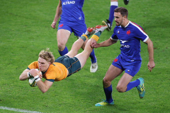 Wallabies halfback Tate McDermott crossing for a five-pointer against France in July 2021.