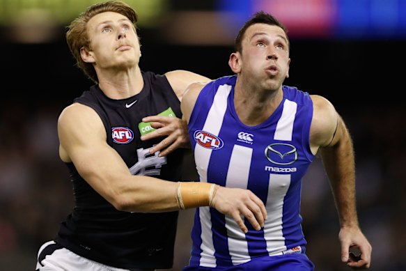Dan Gorringe takes on North Melbourne’s Todd Goldstein in a ruck contest in 2016.