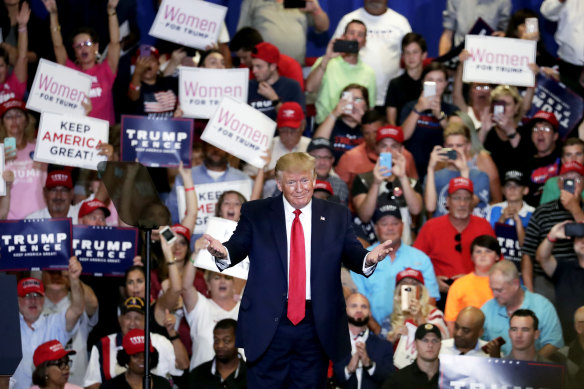 US President Donald Trump acknowledges the crowd as he speaks at a campaign rally in Fayetteville, North Carolina, on Monday.