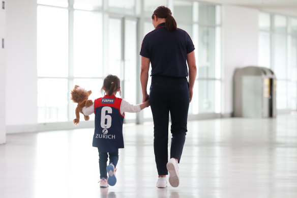 Pearce and her daughter Sylvie at the MCG.