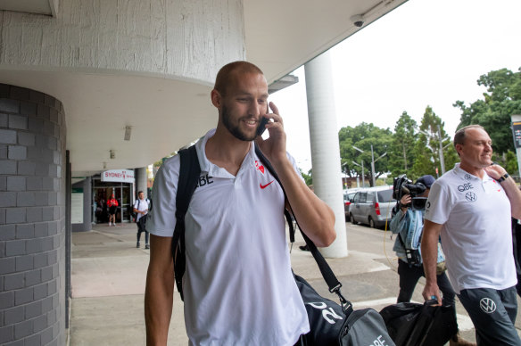 Reid with the Swans at Sydney airport before their flight to Melbourne on Thursday afternoon.