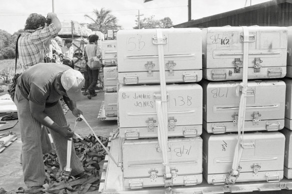 Jim Jones’s coffin is stacked among those of his hundreds of followers, awaiting transport out of Jonestown.