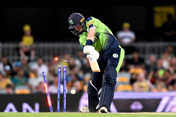 George Dockrell of Ireland is clean bowled by  Mitchell Starc.