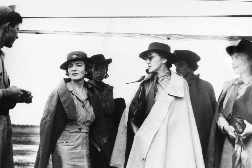 Herald journalist Connie Roberts in sunglasses and white coat during World War II.