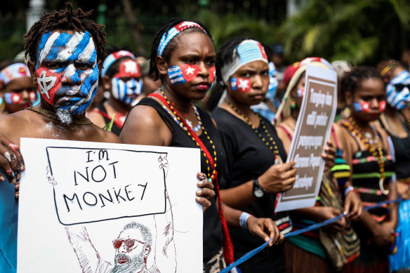 Papuan students, their faces painted in the colours of the banned Morning Star flag, protest in Jakarta on August 28. 