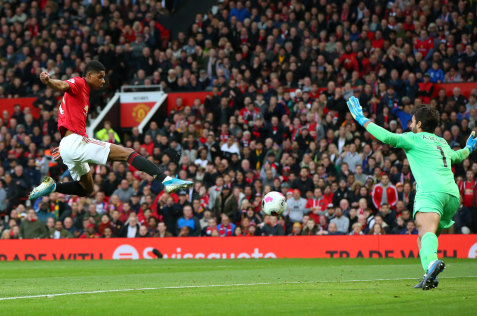Marcus Rashford scores the opener for Manchester United.